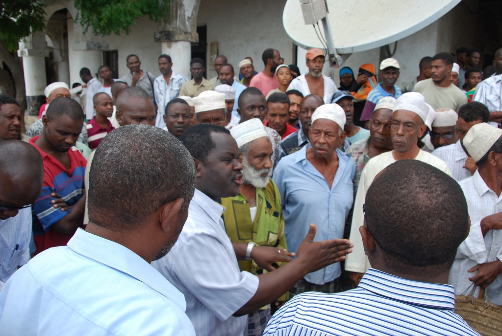 PS, Dr. Cyrus Njiru, answering queries from the the Save Lamu Chairman (mid far-right)